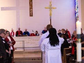 Procession with the cross into Christ Chapel 